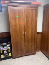 6 ft wooden cabinet in S basement