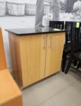 wooden cabinet w/ solid surface top