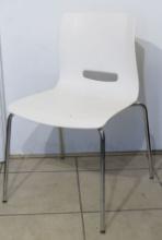 White Molded Fiberglass Chairs on chrome steel legs