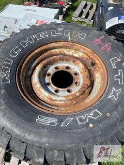(3) Trail Mark LT235-85 R 16 tires with rims, (2) LT 265-75 R 16 Michelin LTX tires