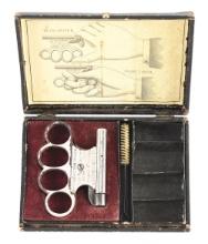 (A) LE CENTENAIRE KNUCKLE GUN WITH RARE ORIGINAL PICTURE BOX.