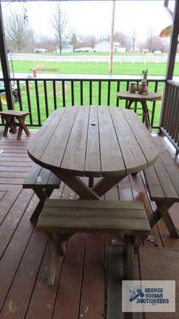 oval picnic table with four benches