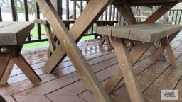 oval picnic table with four benches