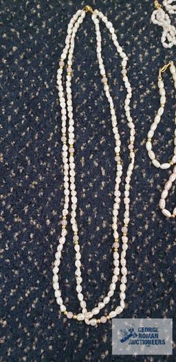 Pearl like costume jewelry necklaces, bracelets, earrings