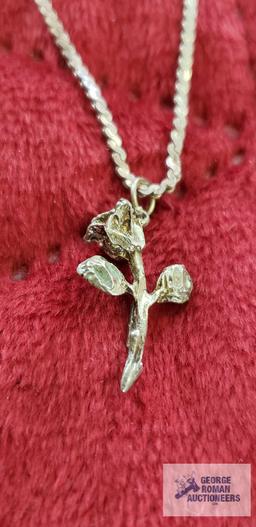 Silver rose pendant, marked Sterling on silver colored necklace, marked B. David Sterling,