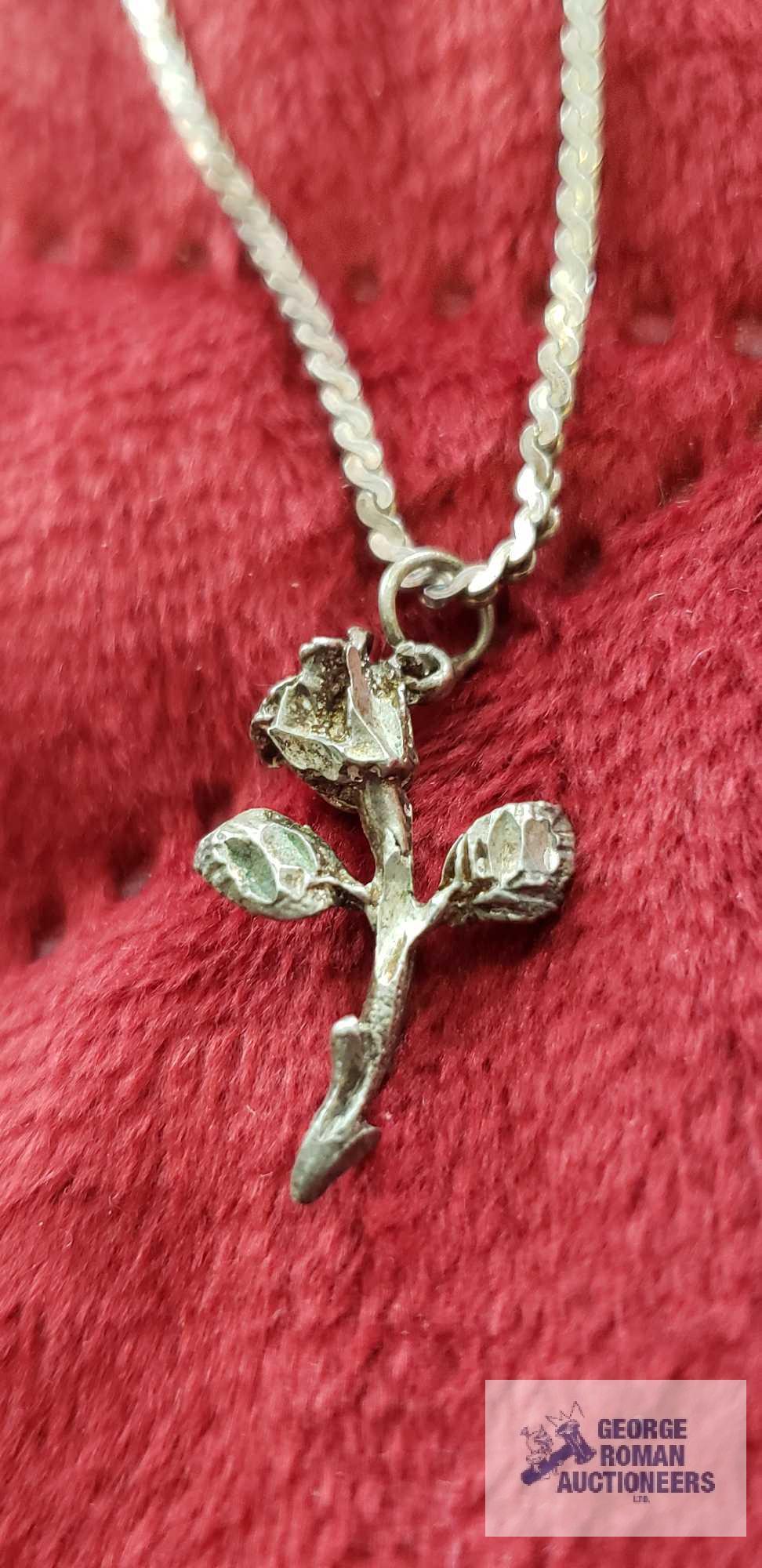 Silver rose pendant, marked Sterling on silver colored necklace, marked B. David Sterling,