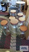 Glass jars with cork type lids and box of assorted drink cups