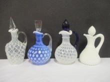 Four Blue and White Art Glass Cruets