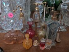 (LR) LOT OF (11) VINTAGE VARIOUS SIZED COLORED AND CLEAR GLASS PERFUME BOTTLES.