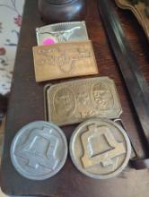 (FD) LOT OF 5 BELT BUCKLES. TIFFANY AND CO WELLS FARGO CO, HIT LINE USA, BULL, AND THE GETTY CENTER