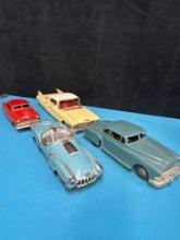 4 vintage friction toy cars Cadillac Buick jaguar