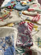 large grouping of 60s vintage table cloths approx 20