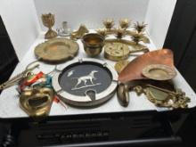 brass items mask horoscope ashtray candlesticks door knocker etc.